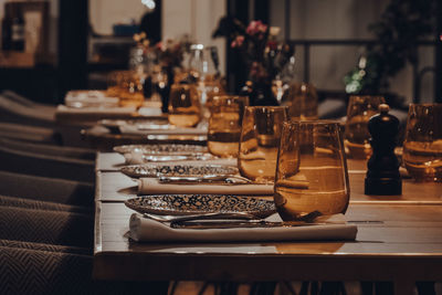 Close-up of wine glasses on table