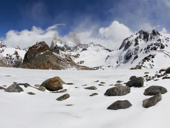 Scenic view of snowcapped mountains against sky