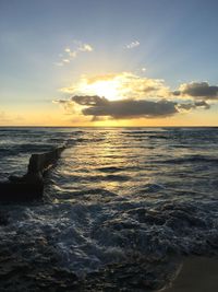 Scenic view of calm sea at sunset