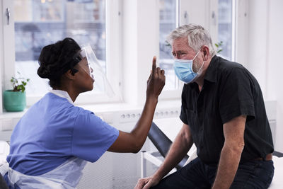 Senior man having eye exam during doctor appointment