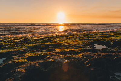 Scenic view of sea against sky during sunset