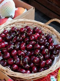 High angle view of strawberries in basket on table