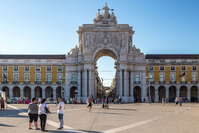 Group of people in front of historical building