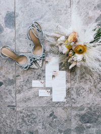 Low section of woman with bouquet