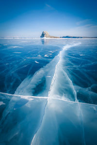 Frozen sea against blue sky