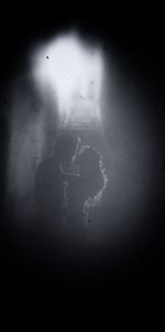 High angle view of shadow on wet wall