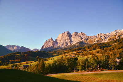 Scenic view of mountains against clear blue sky