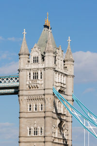 Low angle view of building against cloudy sky