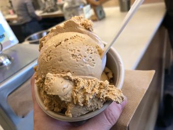 Close-up of hand holding ice cream