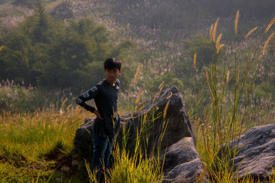 Side view of a man on grassland