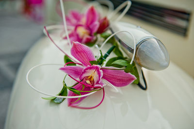 Close-up of pink flowers on vehicle part