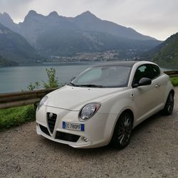 Vintage car on mountain against sky