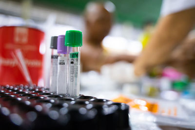 Midsection of man holding syringe