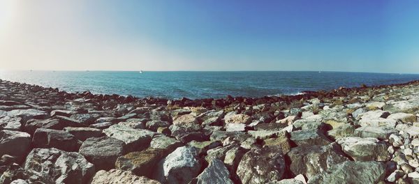 Scenic view of sea against clear blue sky