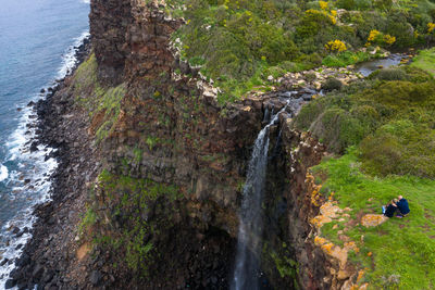Scenic view of waterfall on rocks