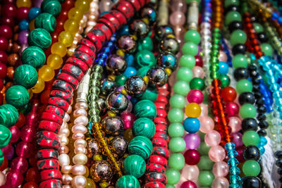 Close-up of multi colored jewelry for sale