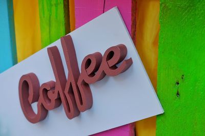 Close-up of coffee text on wood