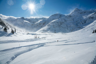 Cross country skier on track in winter wonderland in sportgastein ski resort, gastein, austria