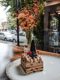 Close-up of dessert in vase on table