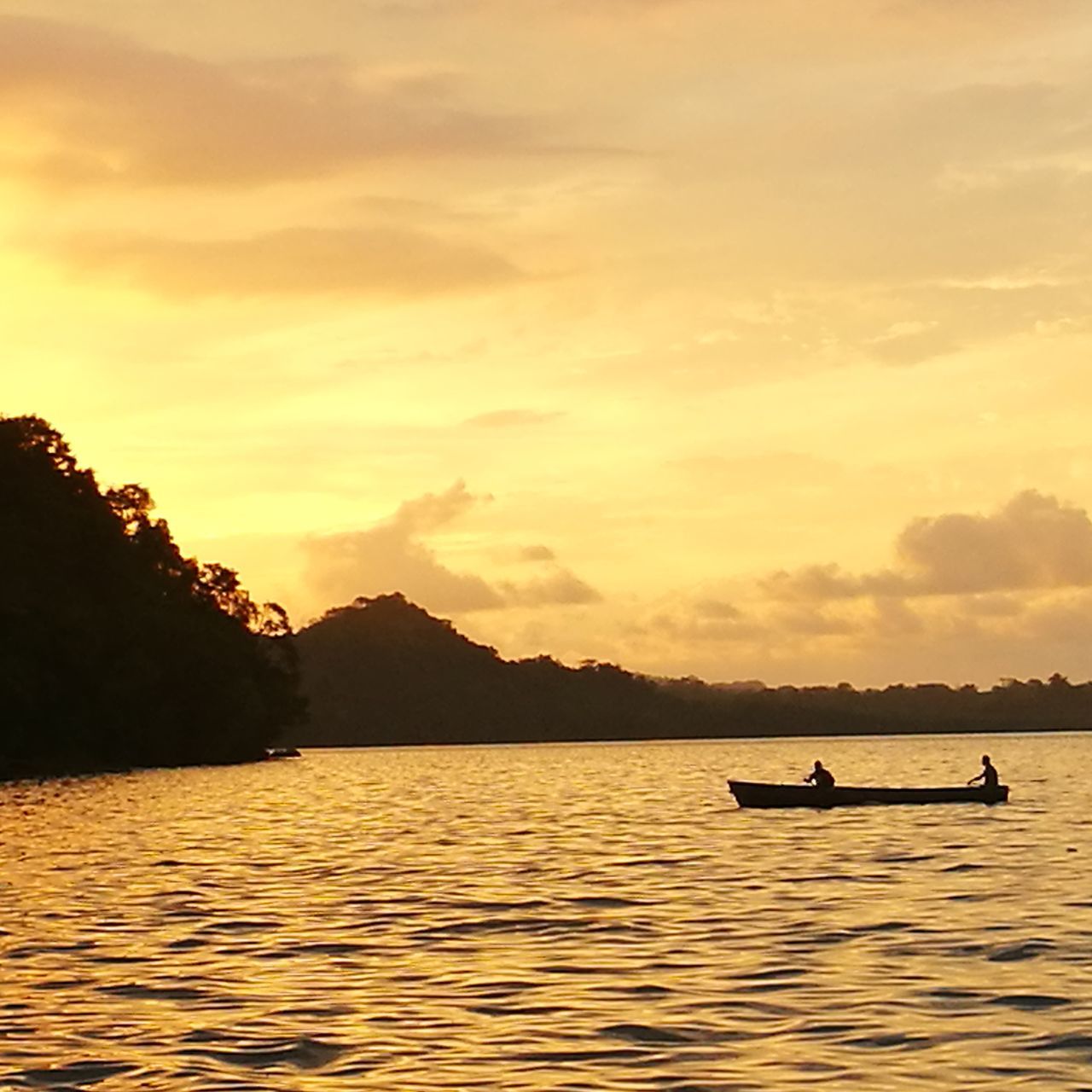 sunset, water, beauty in nature, nature, nautical vessel, scenics, sky, transportation, silhouette, mode of transport, cloud - sky, waterfront, tranquility, outdoors, tranquil scene, lake, real people, two people, men, tree, mountain, jet boat, day, people