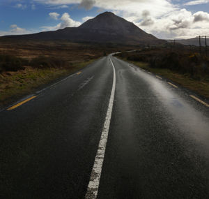 Empty road against sky