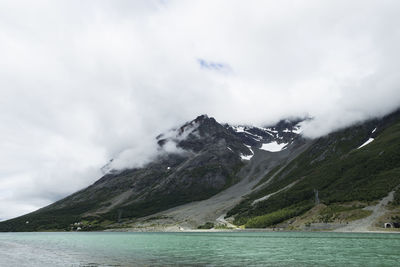 Scenic view of lake and mountains against sky