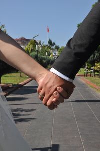 Cropped hand of man holding hands