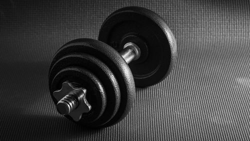 High angle view of dumbbells on floor