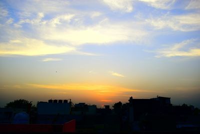 Silhouette of built structure at sunset