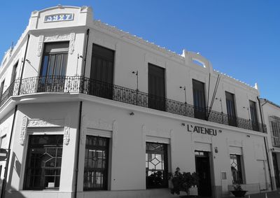 Low angle view of building against blue sky