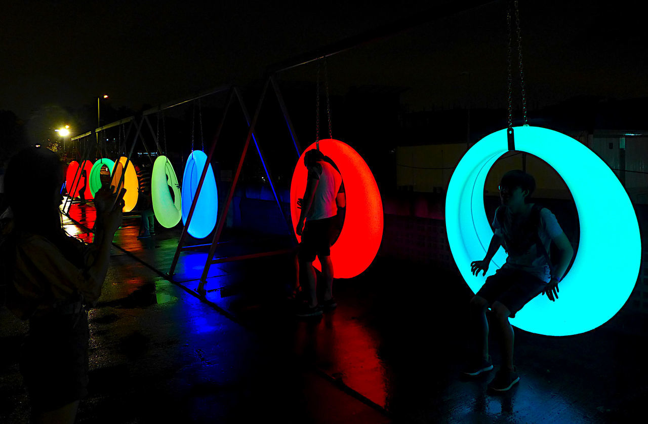 LOW ANGLE VIEW OF ILLUMINATED LIGHTING EQUIPMENT