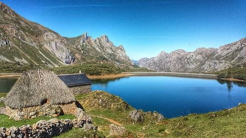 Scenic view of lake and mountains against sky