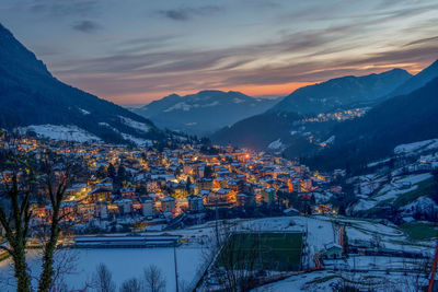 Aerial view of townscape against sky during sunset