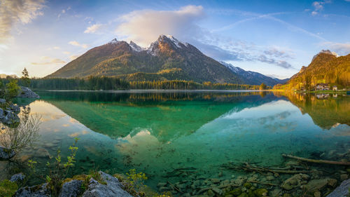 Scenic view of lake against cloudy sky