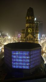 Illuminated buildings in city at night