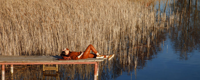 Woman lying down in lake