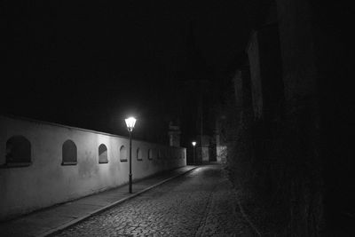 Illuminated lights against sky at night