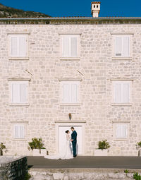 People standing outside building