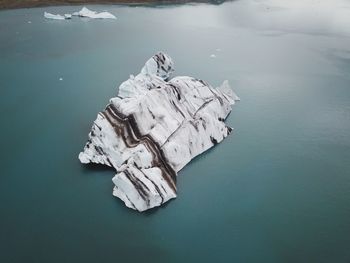 High angle view of iceberg on sea