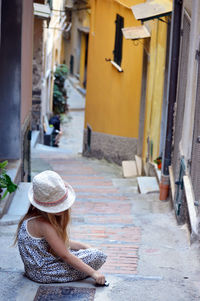 Woman sitting in building