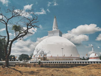 Panoramic view of temple against cloudy sky