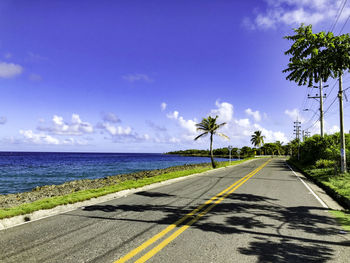 Road by sea against sky