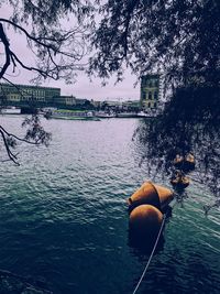 Man by river against sky