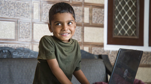 Portrait of smiling boy at home