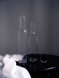 Close-up of wine bottles on table