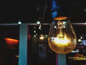 Close-up of illuminated light bulb