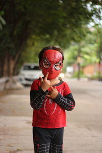 Full length of boy standing on street