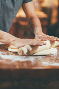 Close-up of person preparing food on table