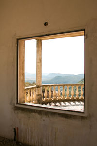 Abandoned building seen through window