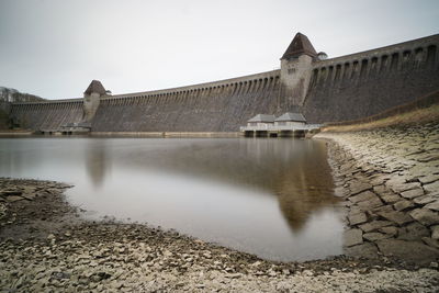 Dam and river against sky